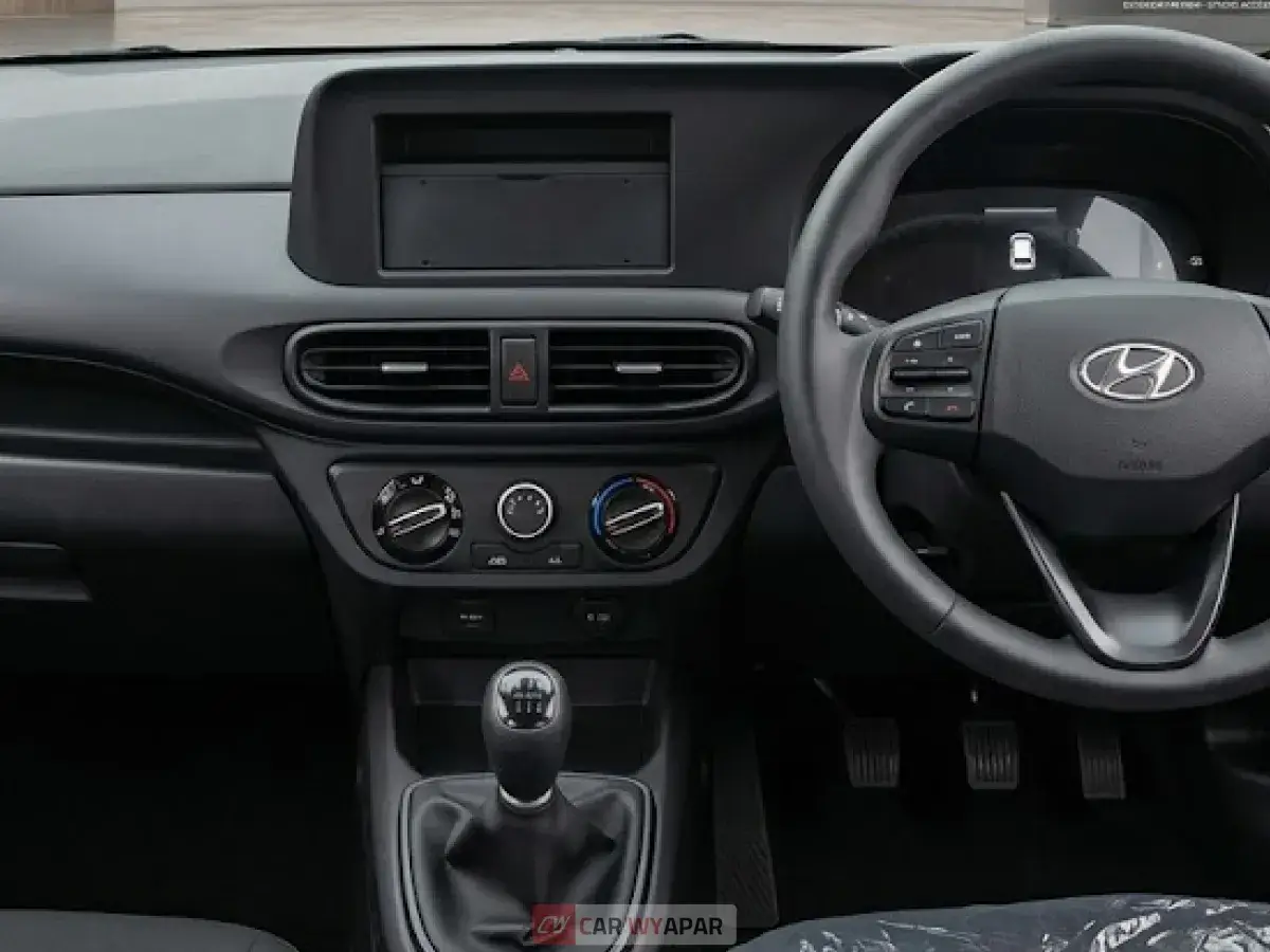 Detailed view of the Hyundai Exter dashboard featuring a digital touchscreen infotainment system and steering controls.